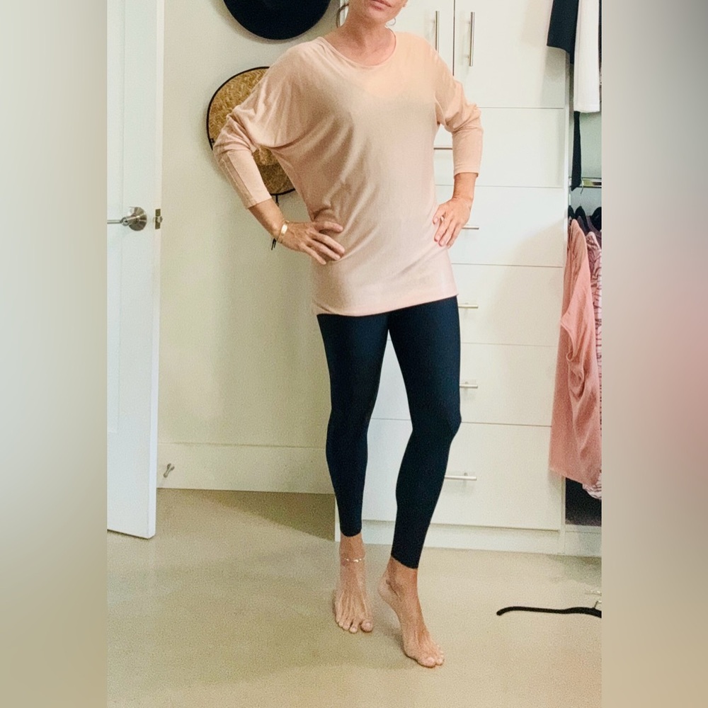 Blush colored long fitted knit top with see thru details on the arms